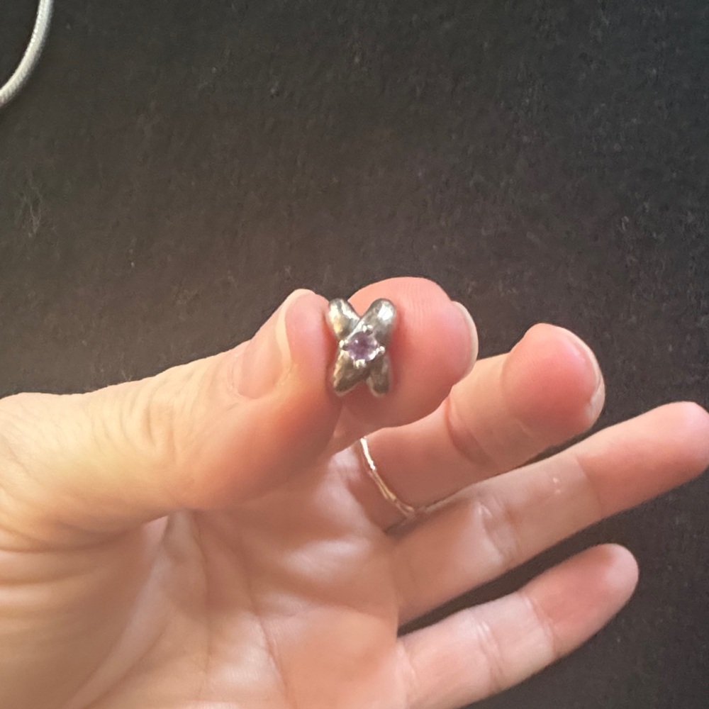 Rare and retired amethyst Pandora charm with 14k gold prongs